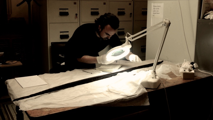 Examining the 10th Century Ballinderry Bow, at the National Museum of Ireland. 